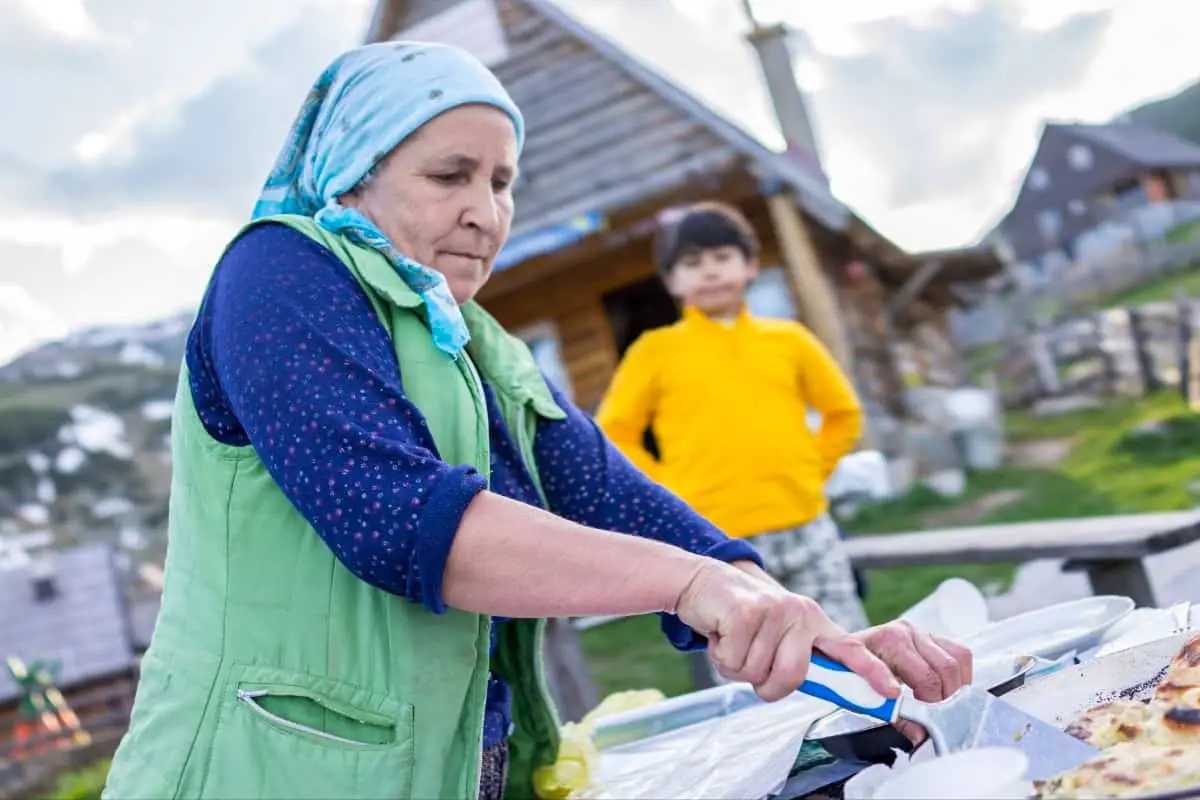 Bosnian Woman Serving Handmade Pita