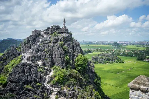 Top pagoda of Hang Mua temple, rice fields, Ninh Binh, Vietnam - ultimate vietnam travel guide