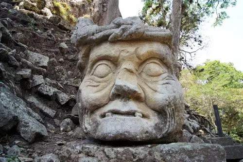 Stone head of old man on the ruins of Copan, Honduras