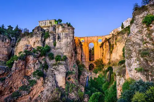 Ronda, Spain at Puente Nuevo Bridge at dusk.