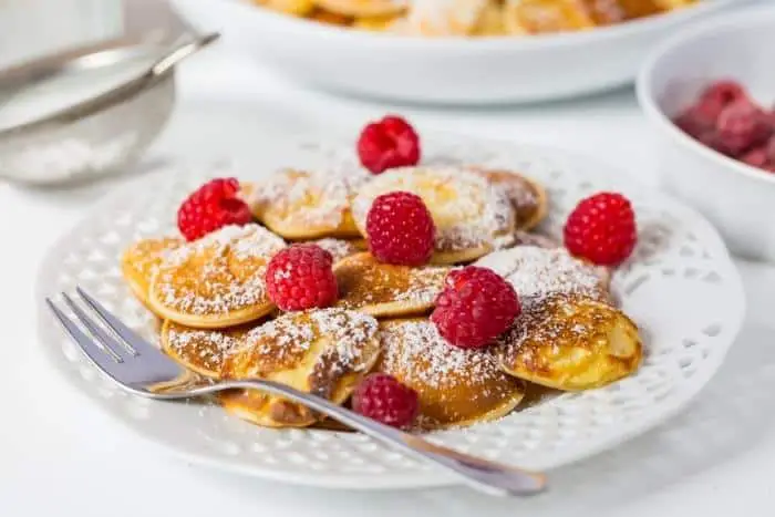 Poffertjes - Small Dutch Pancakes with Fresh Respberries, Traditional Dutch Cuisine