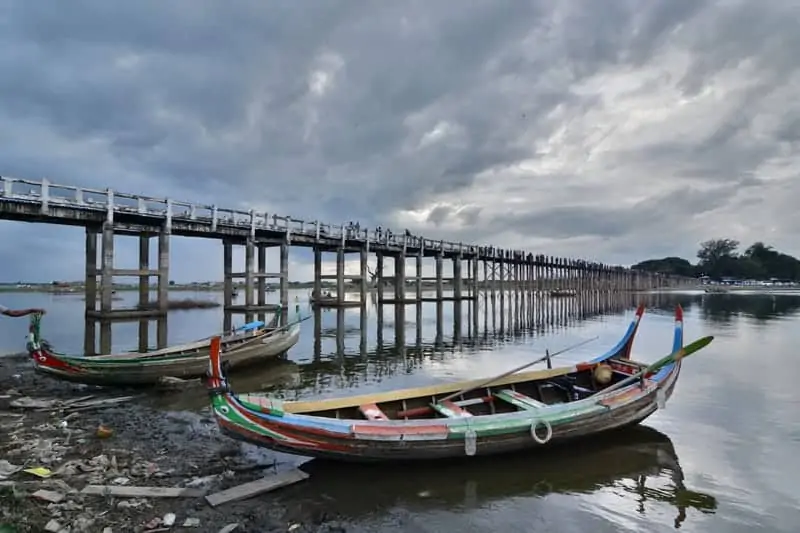 U Bein Bridge is a crossing that spans the Taungthaman Lake near Amarapura in Myanmar. It was built around 1850 and is believed to be the oldest and longest teakwood bridge in the world budget myanmar travel guide