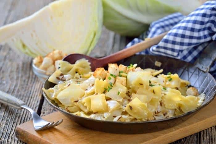 An Austrian specialty called 'Kraufleckerl'. Pasta with fried white cabbage and bacon. - Austrian Dishes