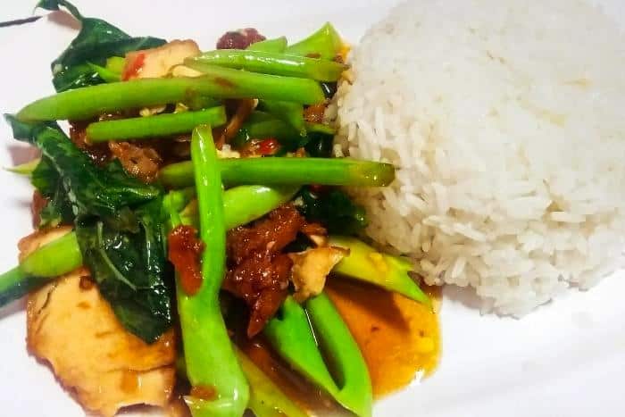 Lao Dish called Khua Pak Bong, Stir-fried Water Spinach with Pork and Steamed Rice - Laotian Food