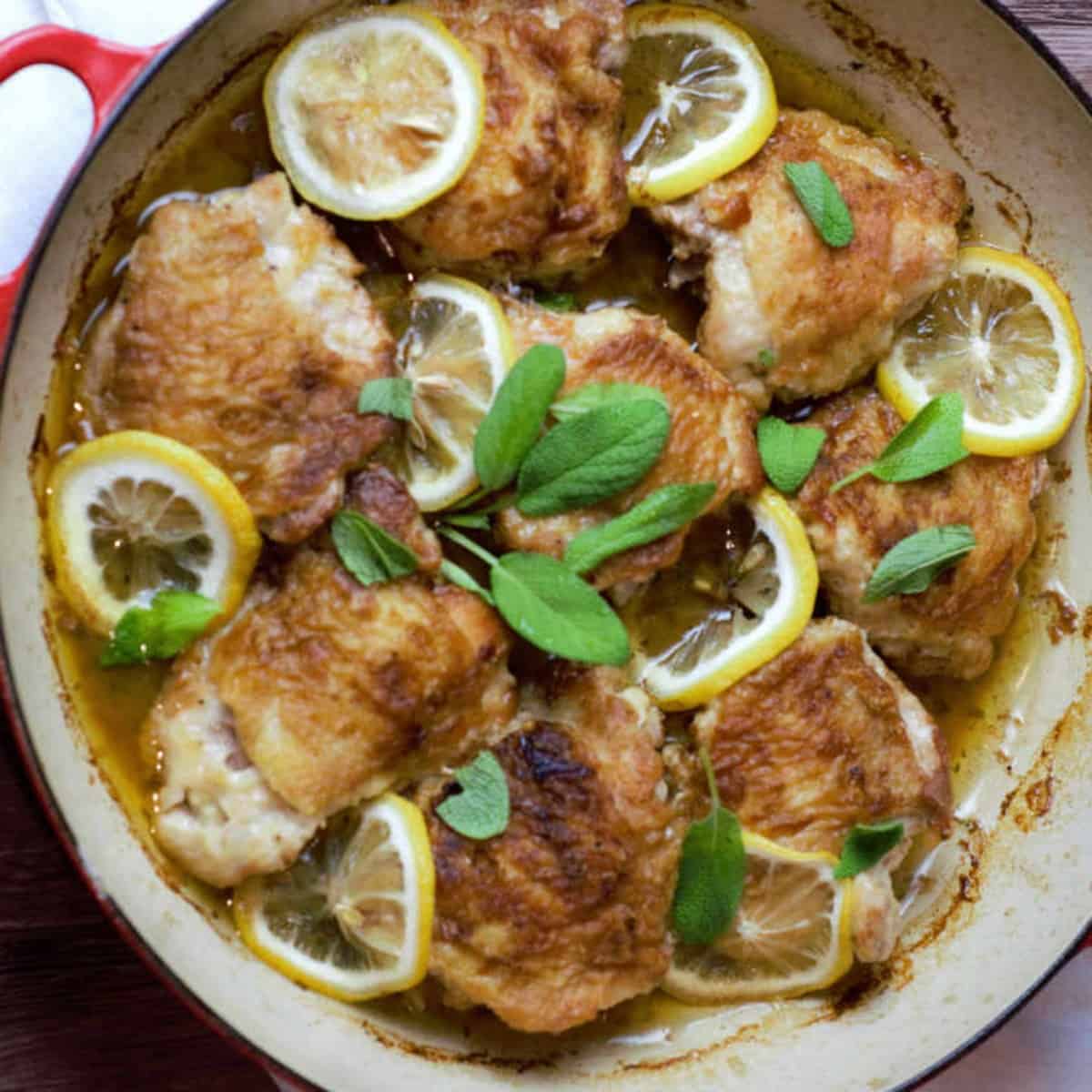 Dutch Oven Chicken Thighs with Lemon Sage Butter Sauce - Dutch Oven Recipes for Chicken Thighs