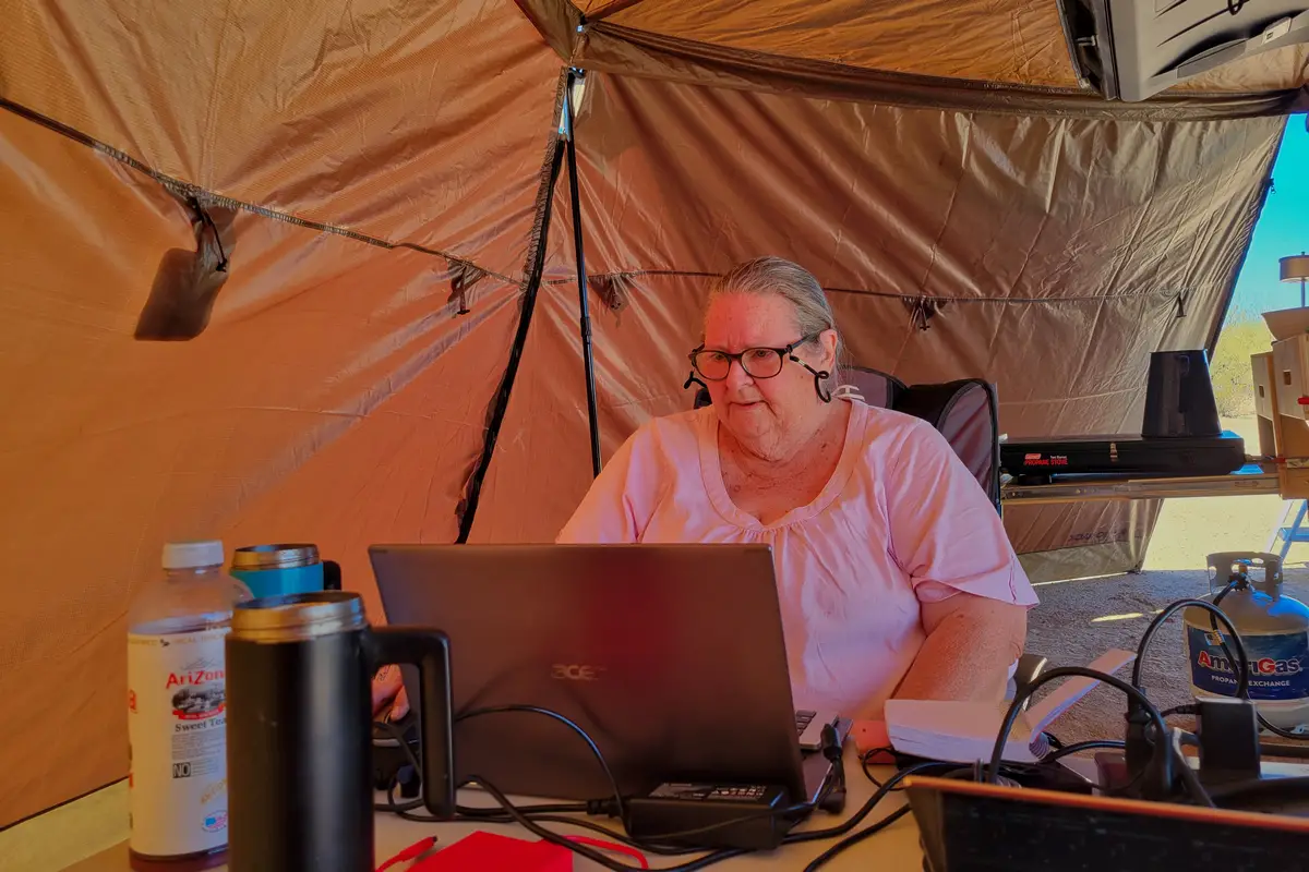 Laurel Working in the Tent - Travel Writer